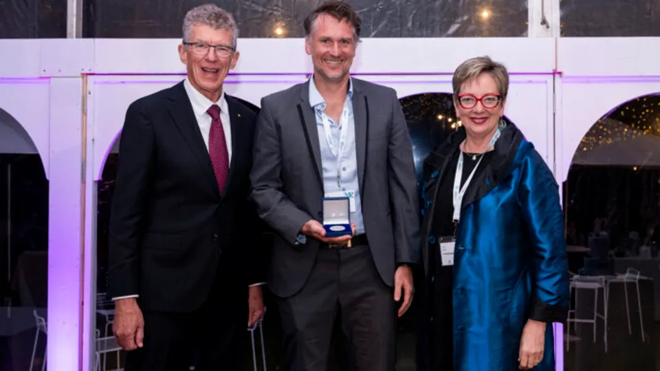 Professor James Hudson with the Jian Zhou Medal and Emeritus Professor Ian Frazer & AAHMS President Professor Louise Baur